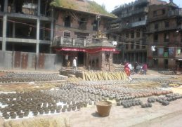 Rows of clay pots drying in Bhaktapur Pottery Square.