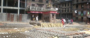 Rows of clay pots drying in Bhaktapur Pottery Square.