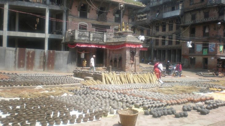Rows of clay pots drying in Bhaktapur Pottery Square.