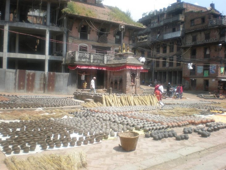Rows of clay pots drying in Bhaktapur Pottery Square.