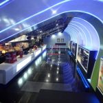 Blue-lit interior of a QFX cinema.