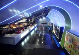 Blue-lit interior of a QFX cinema.