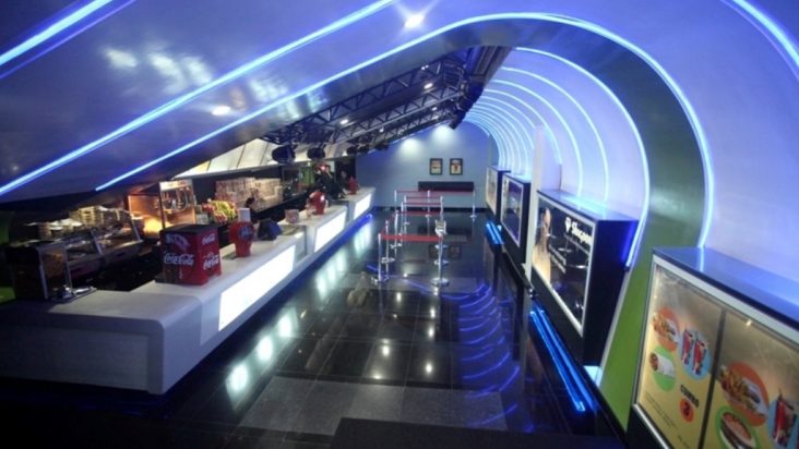 Blue-lit interior of a QFX cinema.