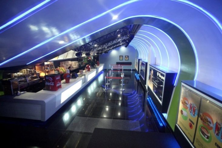 Blue-lit interior of a QFX cinema.