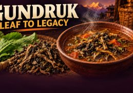 Illustrated bowl of fermented leafy gundruk with fresh mustard greens and dried leaves, under the headline Gundruk: Leaf to Legacy.