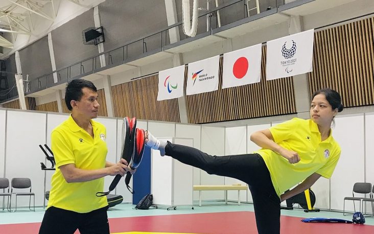 Palesha Goverdhan practising a kick with coach Kabiraj Negi Lama.