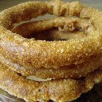 Golden rings of sel roti stacked together.