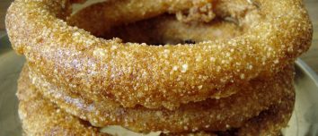 Golden rings of sel roti stacked together.